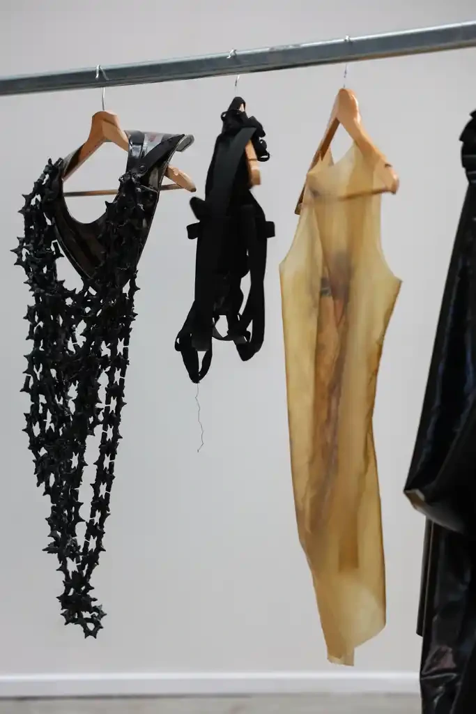 Hellion garments hanging on a rail at the collection presentation.